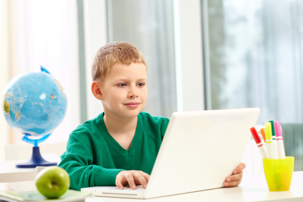 schoolboy-with-laptop-his-desk.jpg