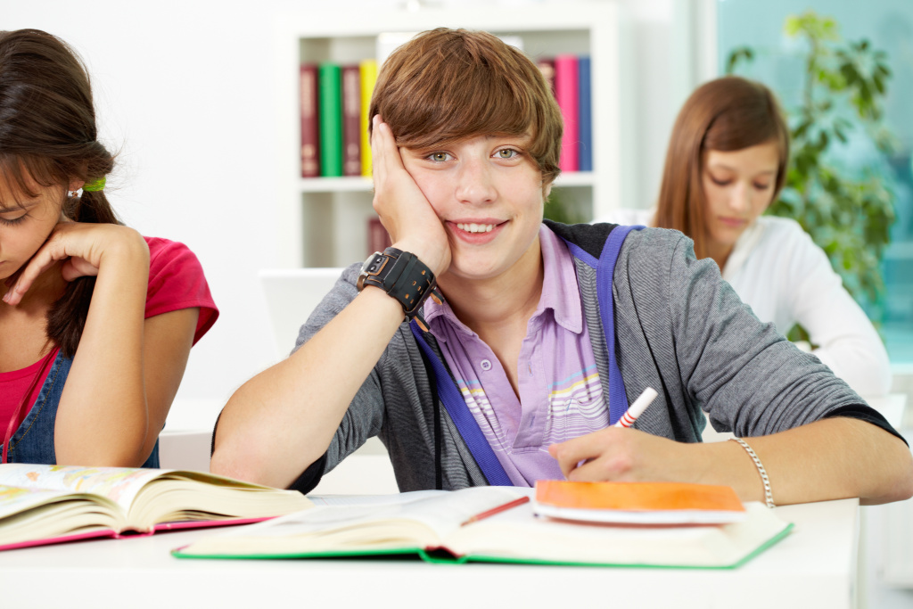 happy-student-holding-pen.jpg happy-student-holding-pen.jpg